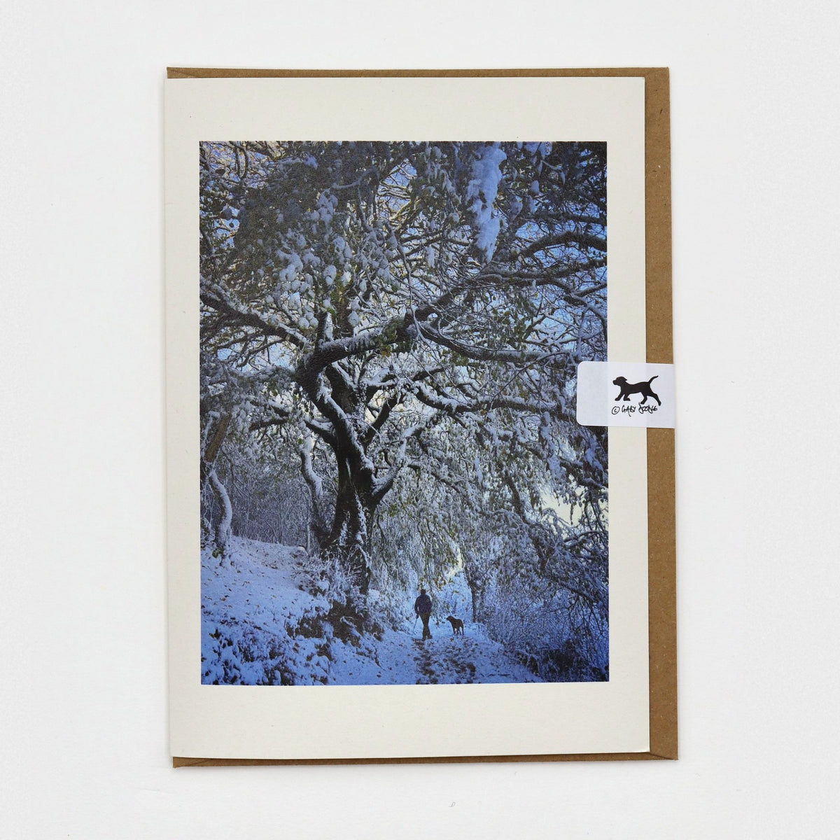Walking Home in the Snow Dartmoor Christmas card on a kraft envelope with Gaby Doodle dog seal